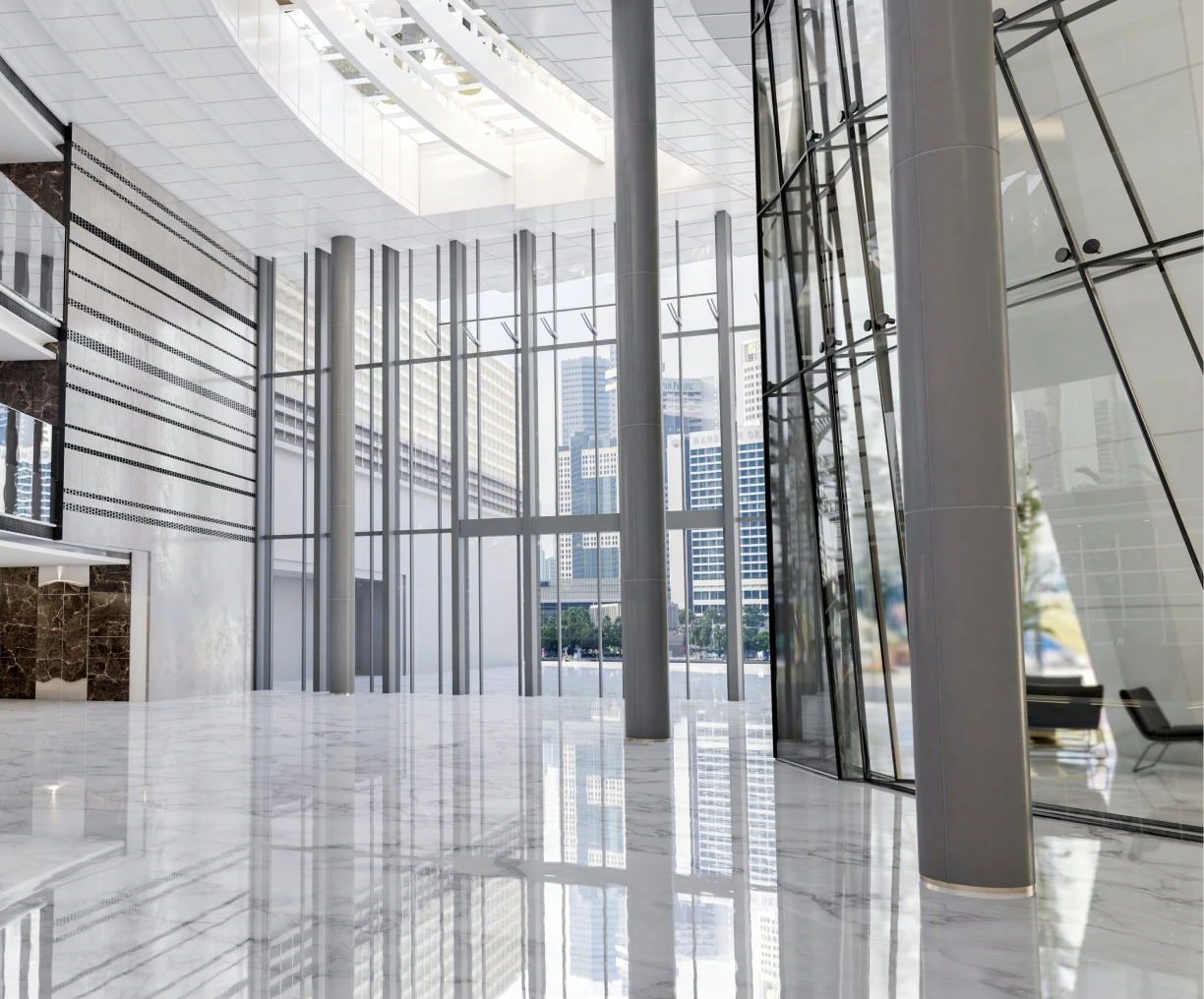 Modern building interior with tall glass windows.